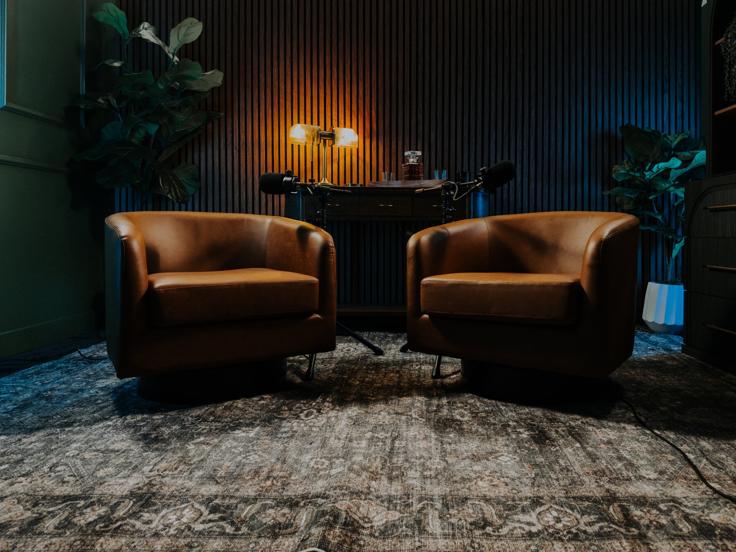 Scottsdale podcast studio with leather chairs and professional video podcast microphones at Pod Bros Media